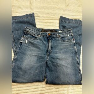 Wrangler, blue jeans, with flare bottoms. Size 32